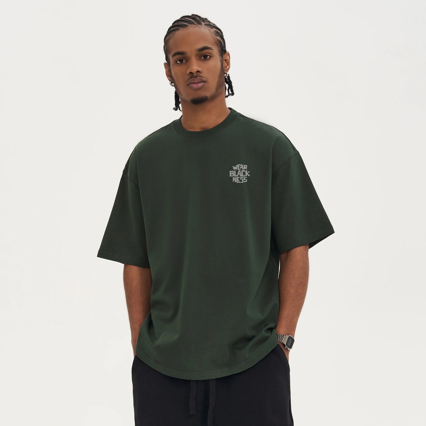 A person in front wearing the wear Blackness Tee-shirt with print. - WEAREBLACKNESS.COM