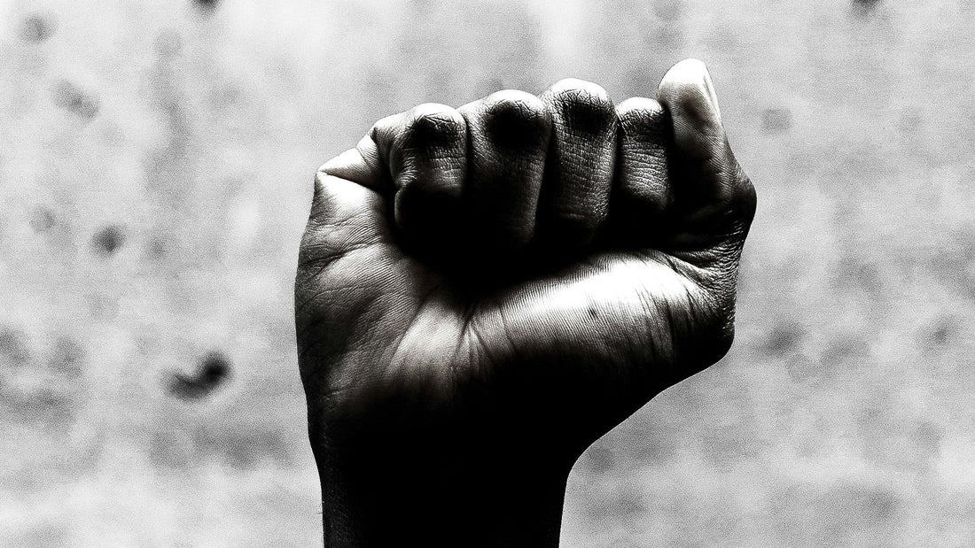 Black and white close-up of a person's clenched fist