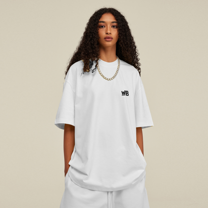 A person wearing the Blackness Emancipation Tee in white!