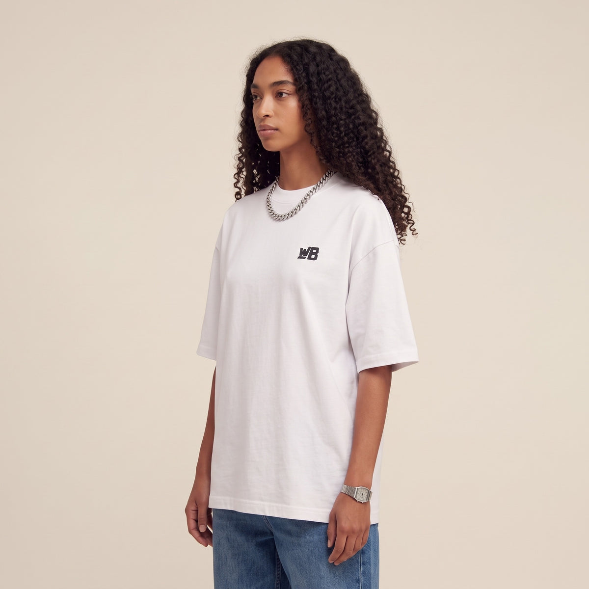 Base Blackness Tee White — side view of the drop-shoulder sleeve and boxy oversized fit, oversized heavyweight cotton streetwear tee by We Are Blackness