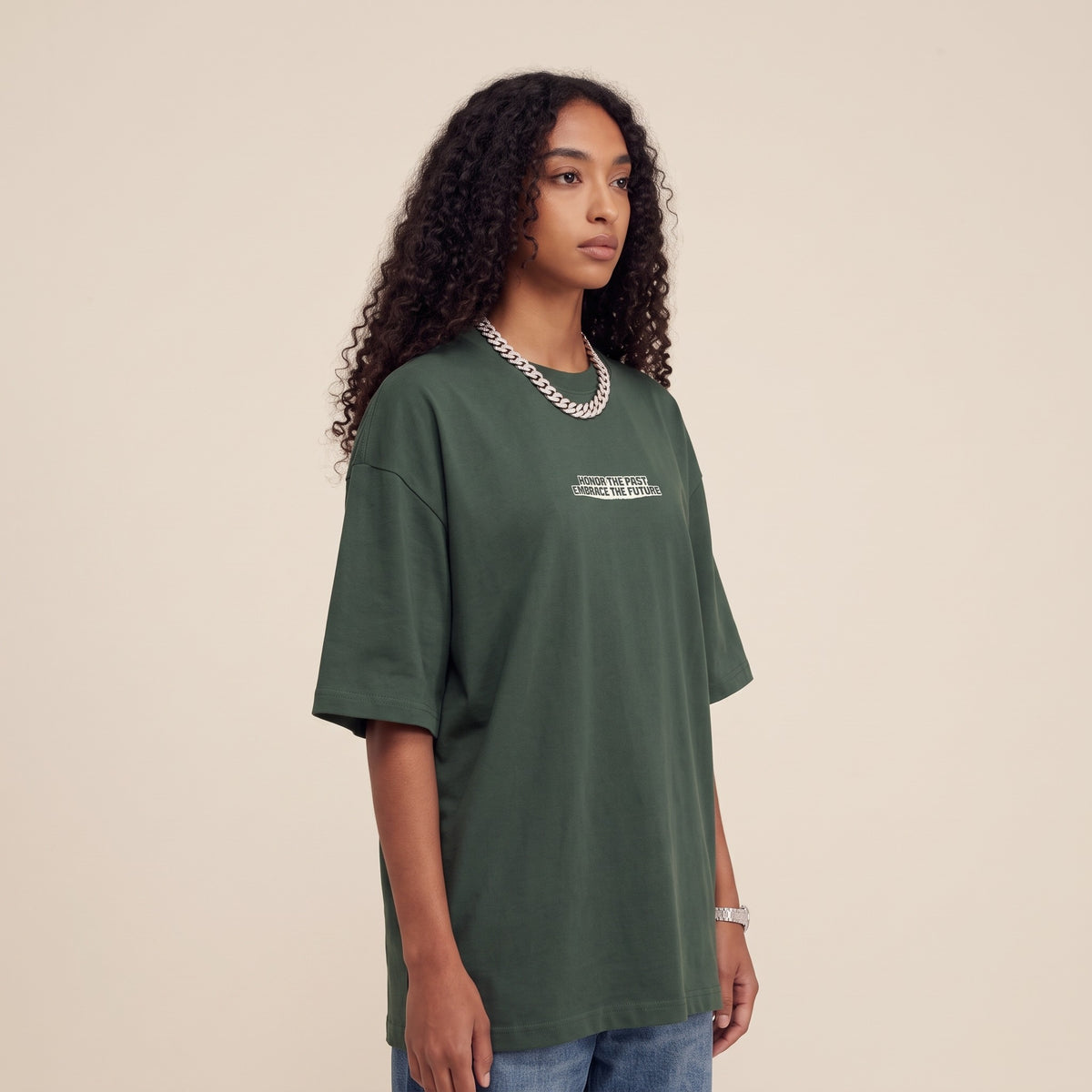 Blackness Honor & Embrace Tee Cactus Green — side view of the drop-shoulder sleeve and boxy oversized fit, oversized heavyweight cotton streetwear tee by We Are Blackness