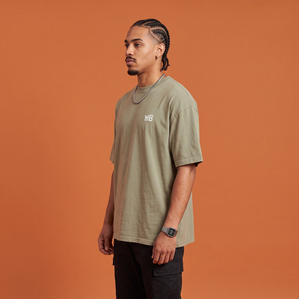 Blackness Mawon Tee Brown Khaki — side view of the drop-shoulder sleeve and boxy oversized fit, oversized heavyweight cotton streetwear tee by We Are Blackness