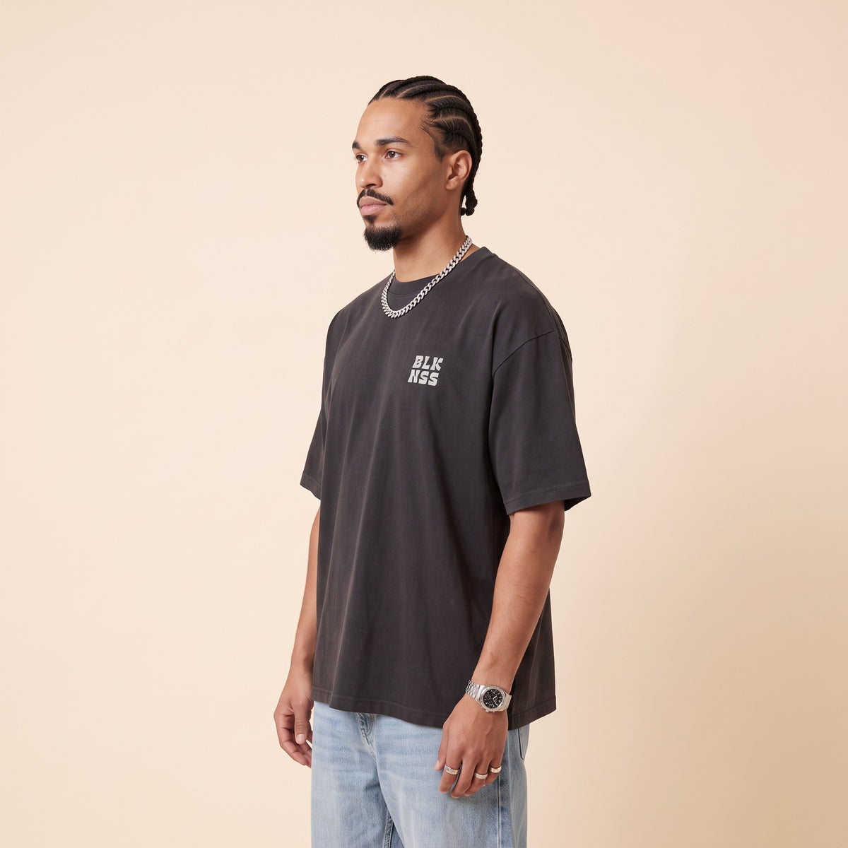 Blackness WABLKNSS Tee Black — side view of the drop-shoulder sleeve and boxy oversized fit, oversized heavyweight cotton streetwear tee by We Are Blackness