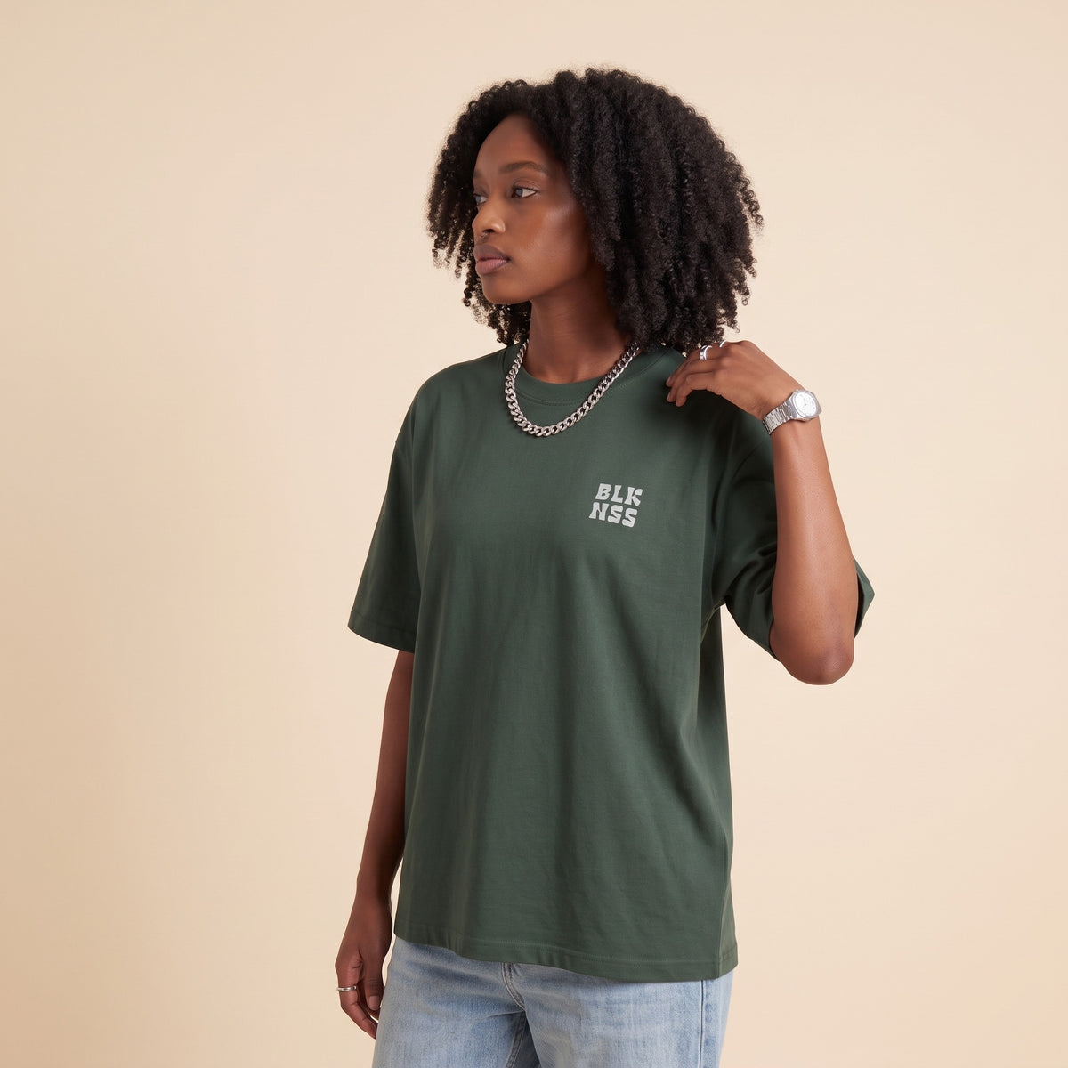 Blackness WABLKNSS Tee Green — side view of the drop-shoulder sleeve and boxy oversized fit, oversized heavyweight cotton streetwear tee by We Are Blackness