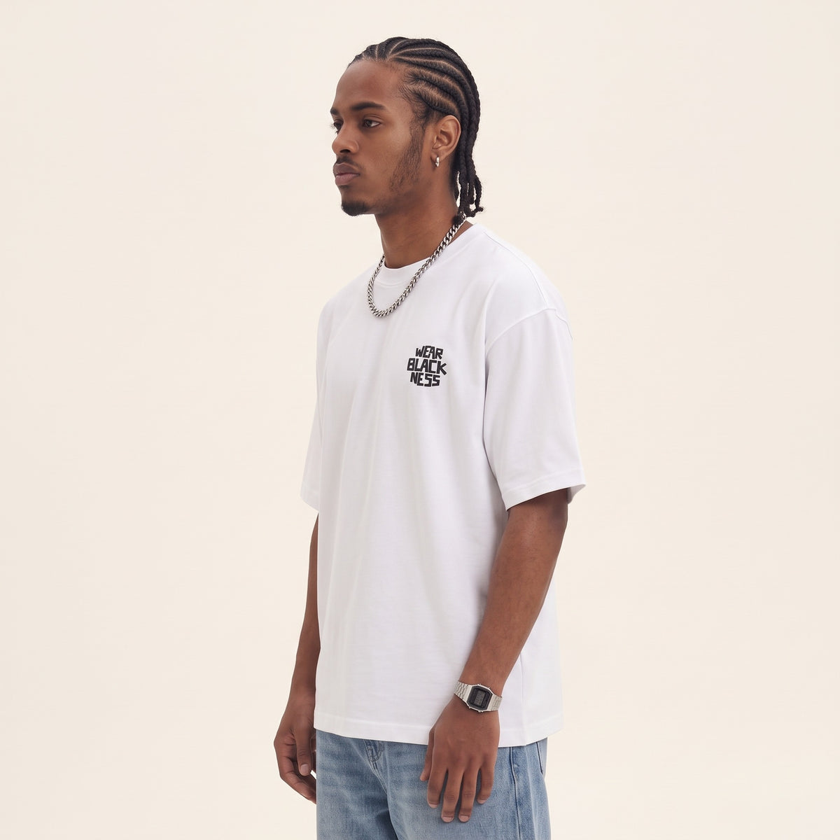 Wear Blackness Tee White — side view of the drop-shoulder sleeve and boxy oversized fit, oversized heavyweight cotton streetwear tee by We Are Blackness